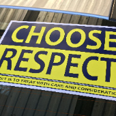 Choose Respect sign in back window of Driving vehicle
